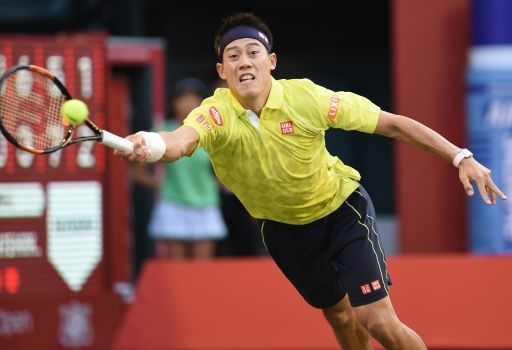 Kei Nishikori stretches for a return against Marin Cilic of Croatia during their quarterfinal match