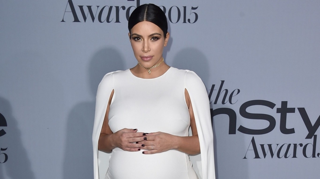 Kim Kardashian shows off her baby bump as she joins fashionable friends at the In Style Awards