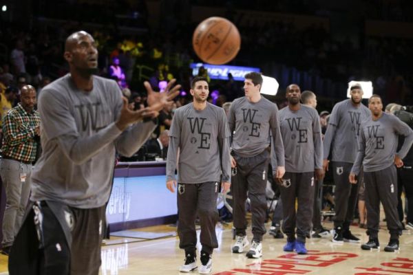 The Minnesota Timberwolves players wear t-shirts in honor