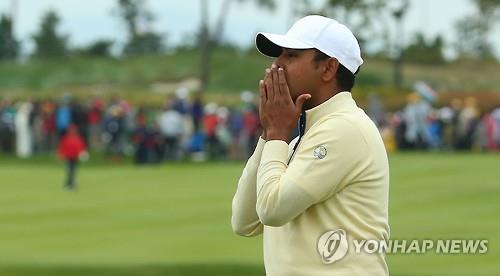 Anirban Lahiri of India reacts after missing a birdie putt at the 18th hole at Jack Nicklaus Golf Club Korea during the Presidents Cup in Incheon on Oct. 11 2015