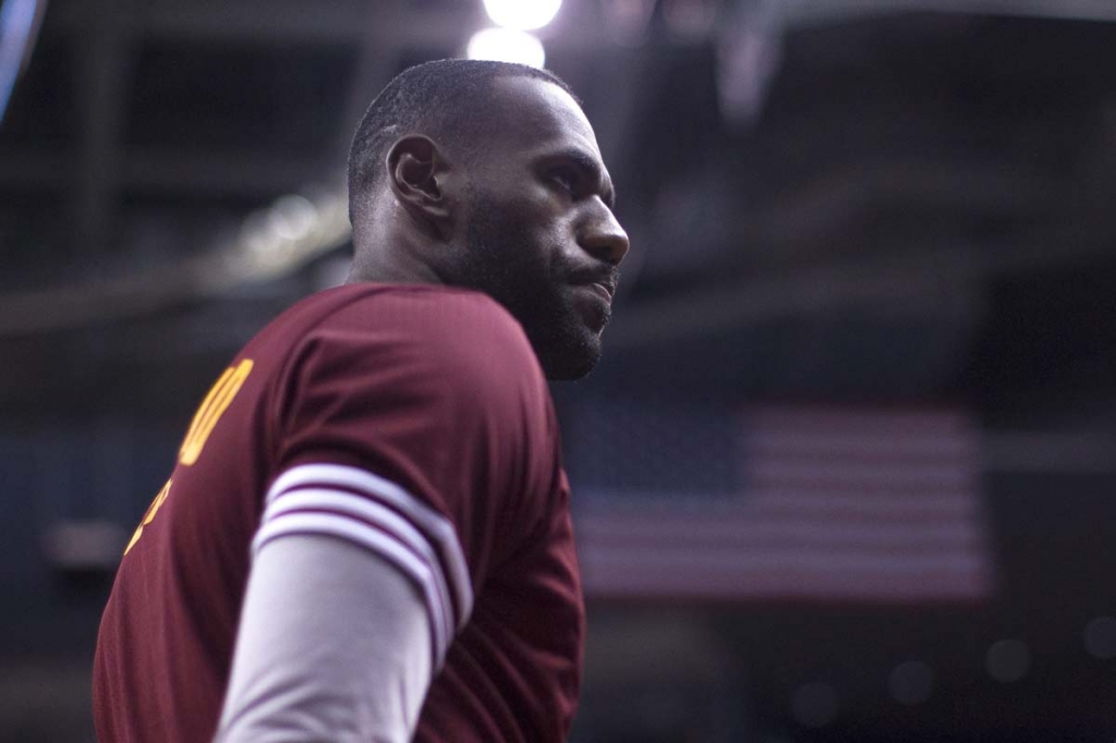 Cleveland Cavaliers&#039 Le Bron James stands on the edge of a team huddle during a timeout in first half of an NBA preseason basketball game against the Toronto Raptors in Toronto on Sunday Oct. 18 2015