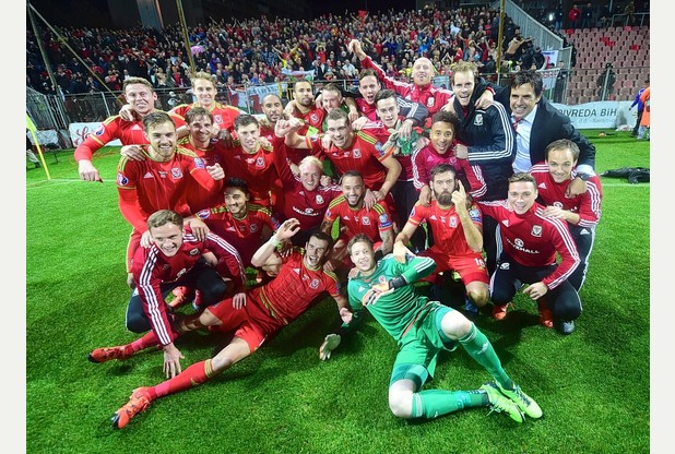 Leicester City players Andy King and Tom Lawrence celebrate Wales&#039 qualification to Euro 2016 with the rest of the squad