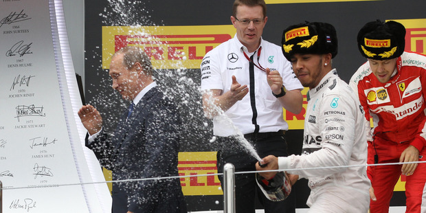 Lewis Hamilton appears to catch Russian President Vladimir Putin with his victory spray