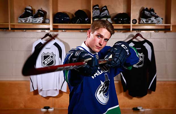 Jake Virtanen strikes a pose in June 2014 after he was selected sixth overall in that year's NHL Entry Draft by the Vancouver Canucks