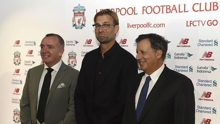 Liverpool's new manager Jurgen Klopp poses with the club's managing director Ian Ayre and chairman Tom Werner at Anfield