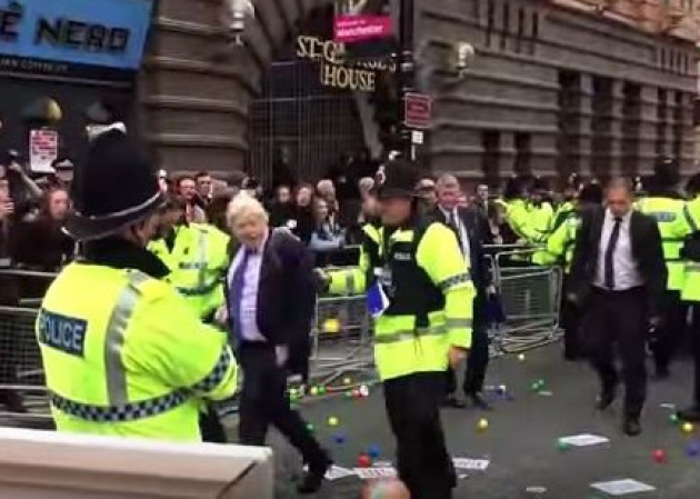 Police ushered the Mayor into the conference as protesters heckled and jeered