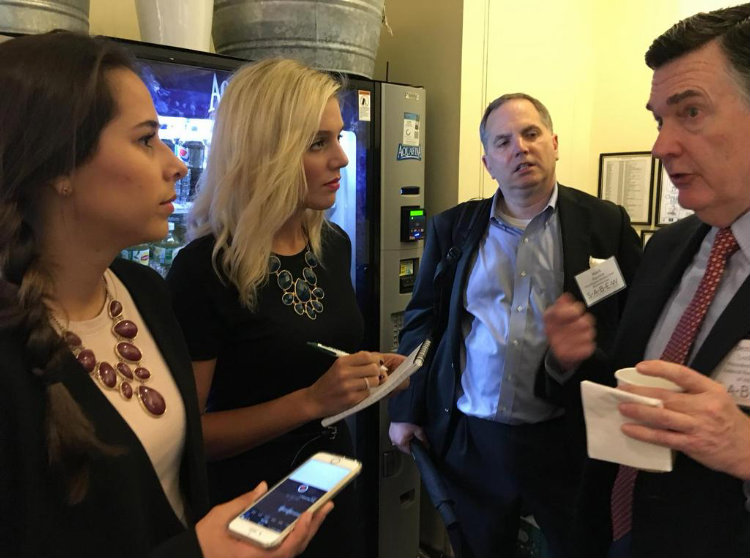 Atlanta Federal Reserve President Dennis Lockhart takes questions from Medill reporters before remarks at a business journalists conference