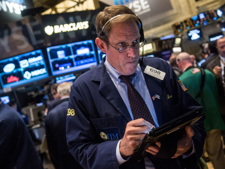 Traders work on the floor of the New York Stock Exchange