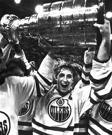 Wayne Gretzky and the Edmonton Oilers carry off the Stanley Cup after defeating the New York Islanders in Edmonton. Gretzky was'The Great One and Mario Lemieux was'The Magnificent One.'The hockey world is always