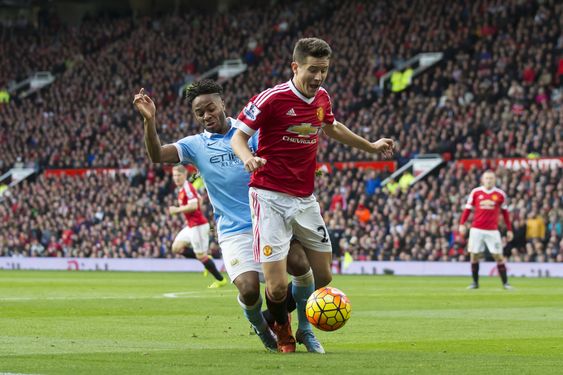 Herrera centre is tackled in the box by Manchester City's Raheem Sterling during the English Premier League soccer match between Manchester United and Manchester City at Old Trafford Stadium Manchester England Sunday