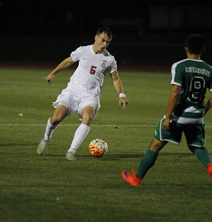 OSU senior defender Liam Doyle tries to get by Cleveland State senior midfielder Victor Zamora on Oct. 21 at Jesse Owens Memorial Stadium. OSU won 1-0. Credit Christopher Slack  Lantern