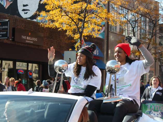 Lynx stars Seimone Augustus and Maya Moore at the start of the parade near 11th & Hennepin