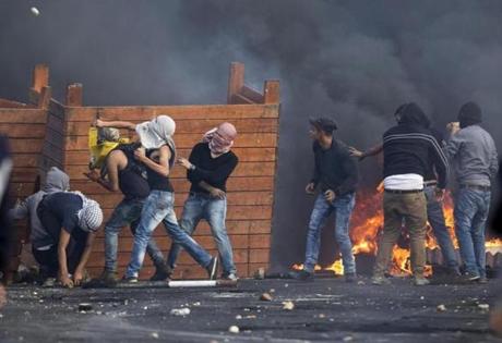 Majdi Mohammed  Associated Press		Palestinian protesters threw stones during clashes with Israeli troops near Ramallah West Bank on Friday