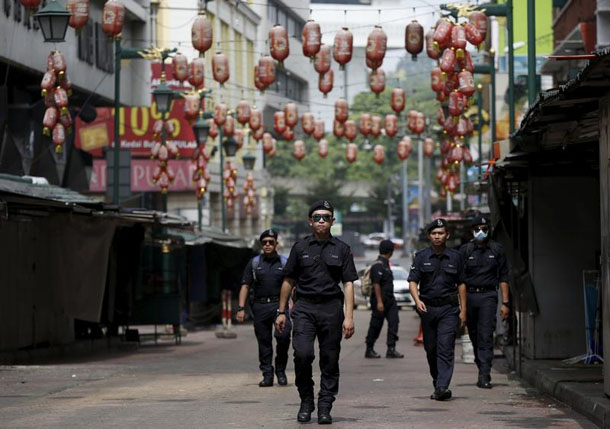 Police patrol a Chinese area of Kuala Lumpur on Sept. 16