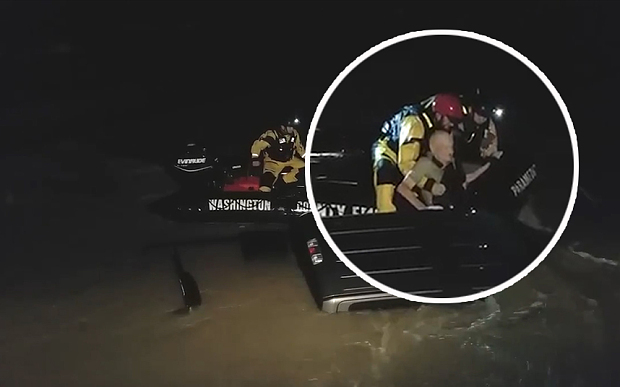 Man and dog rescued from flooded truck