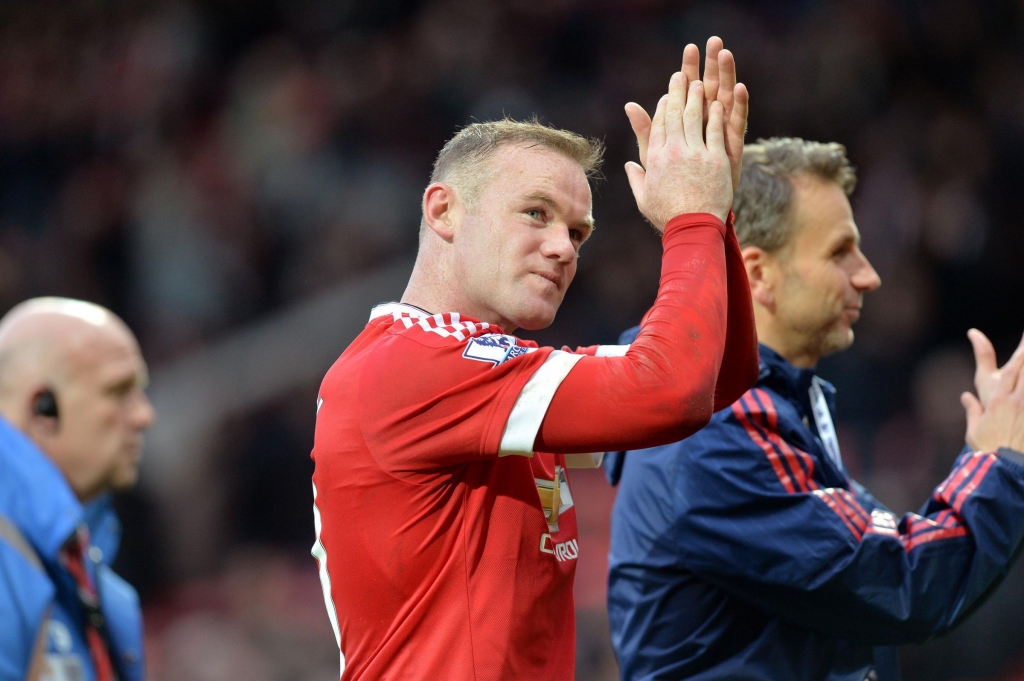 Manchester United's Wayne Rooney applauds the fans after the final whistle of the Barclays Premier League match at Old Trafford Manchester. PRESS ASSOCIATION