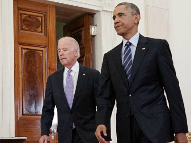 President Barack Obama and Vice President Joe Biden walk from the Green Room to speak on the nuclear deal with Iran