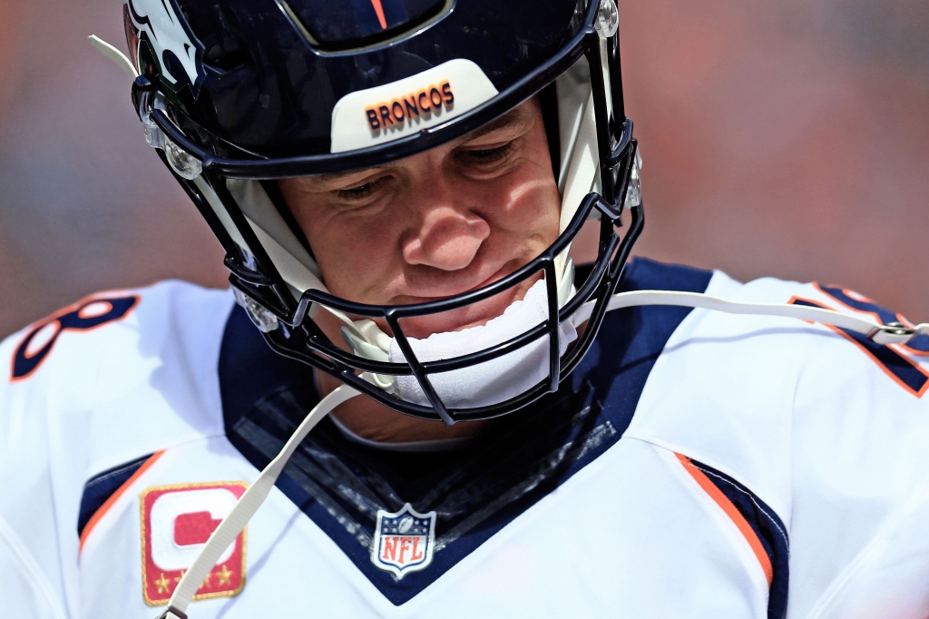 CLEVELAND OH- OCTOBER 18 Quarterback Peyton Manning #18 of the Denver Broncos on the sidelines during the second quarter against the Cleveland Browns at Cleveland Browns Stadium