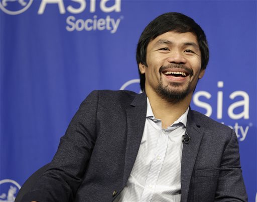 Manny Pacquiao takes questions at the Asia Society in New York Monday Oct. 12 2015. Pacquiao will be honored by the society as the Asia Game Changer of the Year. AP