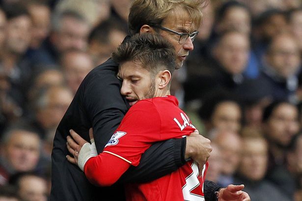 Jurgen Klopp embraces Adam Lallana as he is substituted