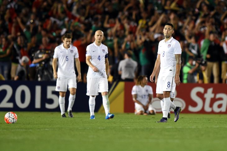 Matt Besler, Michael Bradley and Clint Dempsey react after the US fell to Mexico 3-2 in extra time.- Kirby Lee-USA TODAY Sports