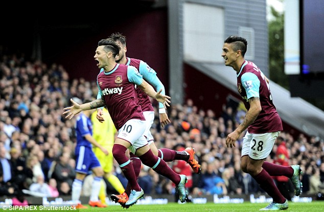 Mauro Zarate celebrates after scoring his 17th minute goal for West Ham United against Chelsea