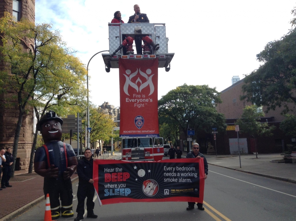 Mayor Lovely Warren joining firefighters and'Buddy with the proclamation of National Fire Prevention Week