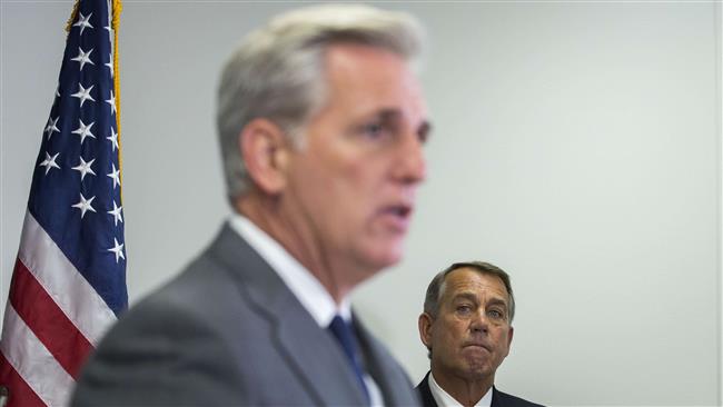 Kevin Mc Carthy  speaks as Speaker of the House John Boehner looks on during a press conference after a closed meeting with fellow Republicans on Capitol Hill