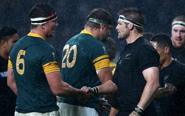 McCaw shakes hands with Francois Louw after the All Blacks defeat South Africa in the World Cup semi-final