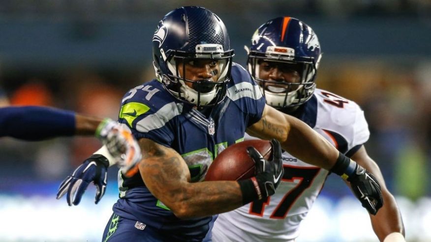 SEATTLE WA- AUGUST 14 Running back Thomas Rawls #34 of the Seattle Seahawks rushes for a touchdown in the fourth quarter against the Denver Broncos at Century Link Field