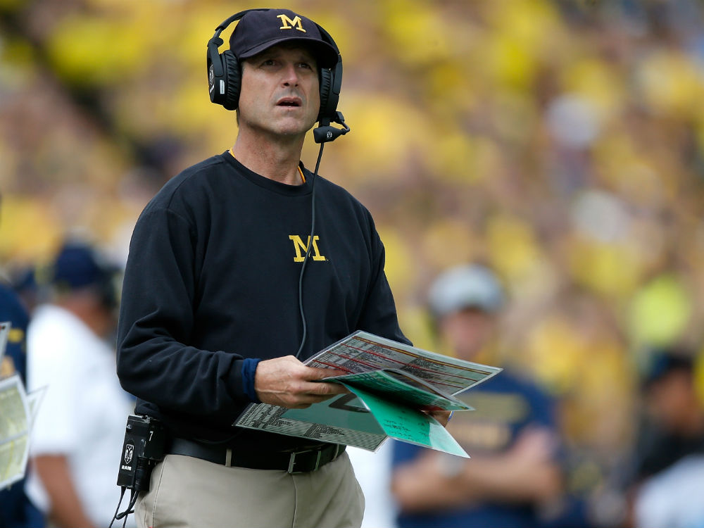 Head coach Jim Harbaugh of the Michigan Wolverines looks on during the fourth quarter while playing the UNLV Rebels