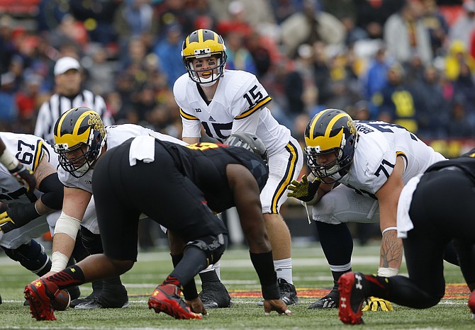 Michigan quarterback Jake Rudock looks across the line of scrimmage before running a play in the second half Saturday against Maryland in College Park Md