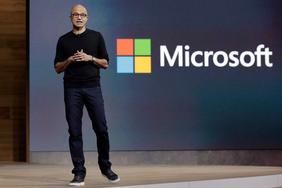 Microsoft CEO Satya Nadella closes a presentation of new devices in New York. Microsoft reports quarterly financial results Thursday Oct. 22 2015