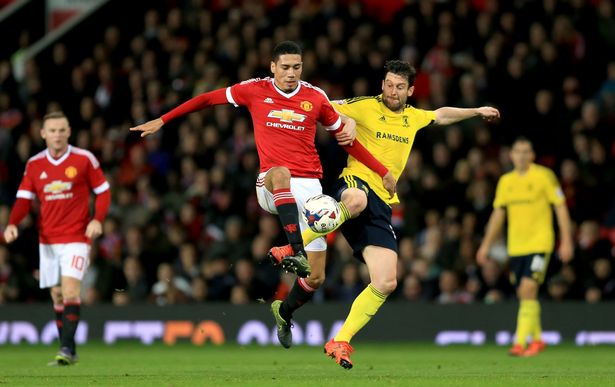 Middlesbrough's David Nugent and Manchester United's Chris Smalling battle for the ball