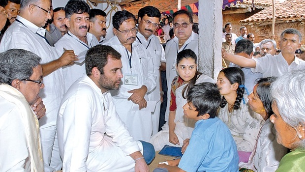 Congress vice-president Rahul Gandhi meeting families of farmers who committed suicide due to crop failure in Mandya district on Friday. Chief Minister Siddaramaiah his ministers and film star Ramya look on | EPS