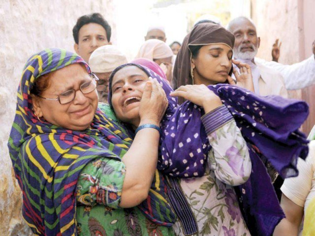 Mohammad Akhlaq’s relatives mourn his death in the Bisara village of Uttar Pradesh