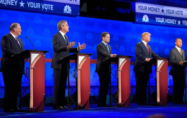 Jeb Bush second from left is flanked by Mike Huckabee left Marco Rubio center Donald Trump second from right and Ben Carson during the CNBC Republican presidential debate at the University of Colorado Wednesday Oct. 28 2015 in Boulder Colo