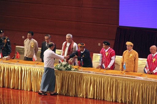 Myanmar President Thein Sein shakes hand with a leader of armed ethnic organization during the signing ceremony of'Nationwide Ceasefire Agreement at Myanmar International Convention Center Thursday in Naypyitaw Myanmar