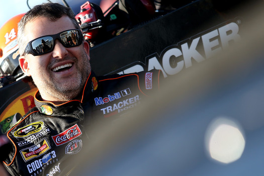 Tony Stewart driver of the #14 Bass Pro Shops  Mobil 1 Chevrolet looks on during qualifying for the NASCAR Sprint Cup Series Federated Auto Parts 400 at Richmond International Raceway