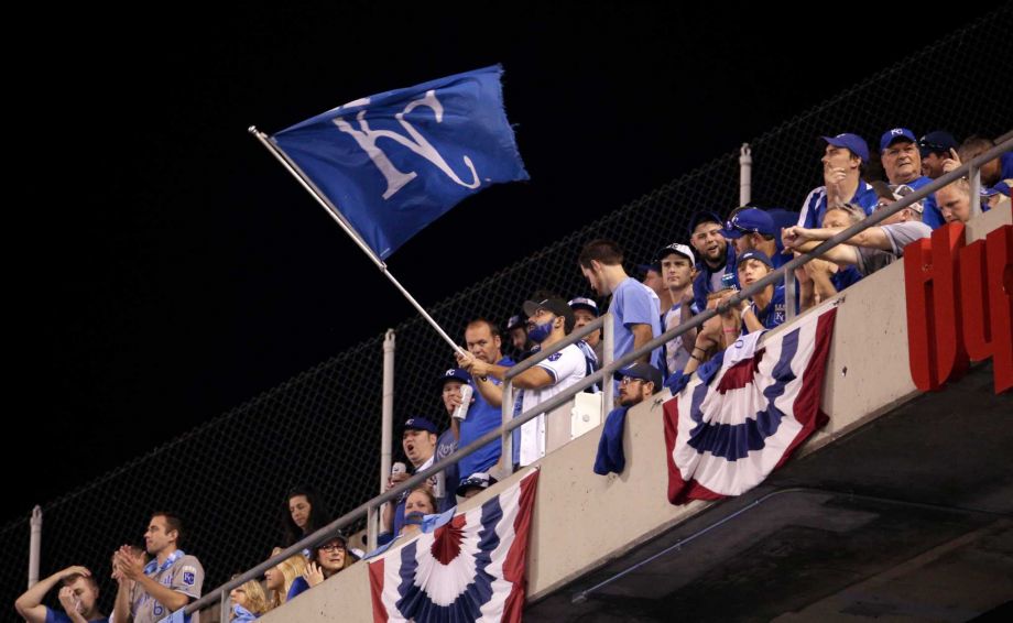 Kansas City Royals fans wave a flag during the sixth inning in Game 1 of baseball's American League Division Series between the Royals and the Houston Astros Thursday Oct. 8 2015 in Kansas City Mo