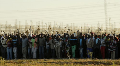 South Africa sent more police to the strike-hit platinum belt on Tuesday to protect miners returning to work this week as producers pushed