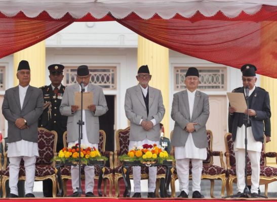 Nepal's President Ram Baran Yadav second left administers