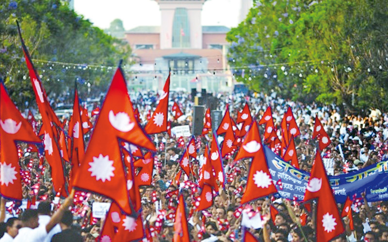 Nepalese waving national flags celebrating in Kathmandu