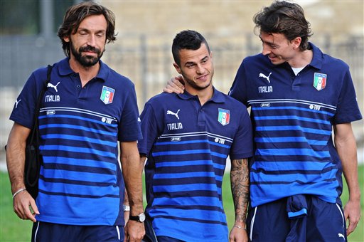 From left Italy's Andrea Pirlo Sebastian Giovinco and Riccardo Montolivo arrive for a training session ahead of Saturday's Euro 2016 qualifying match against Azerbajian at the Coverciano center near Florence Italy Monday Oct. 5 2015. (Ma