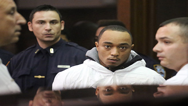 Tyrone Howard appears in Manhattan Criminal Court on Wednesday Oct. 21 2015 in New York. Howard who's accused of stealing a bike and fatally shooting Officer Randolph Holder in the head after a chase Tuesday night was arrested Wednesday on robbe