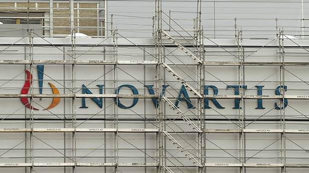 Swiss drugmaker Novartis’ logo is seen behind scaffolding at the company’s plant in the northern Swiss town of Stein