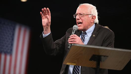 Democratic presidential candidate Sen. Bernie Sanders speaks to guests at the Jefferson Jackson Dinner