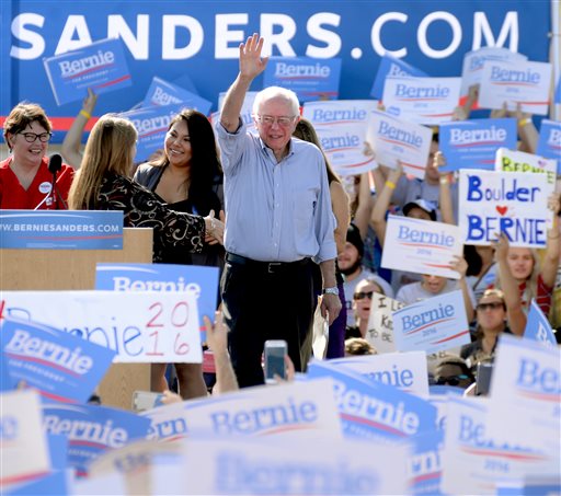 Democratic presidential candidate Sen. Bernie Sanders of Vermont waves to the crowd as he arrives on the stage at the University of Colorado campus in Boulder Colo. on Saturday Oct. 10 2015