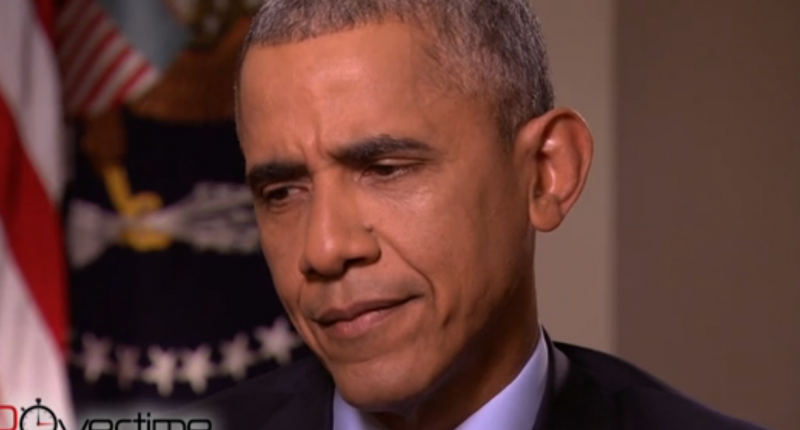 Image President Barack Obama reacts to Steve Kroft's assertion that Putin is challenging his leadership