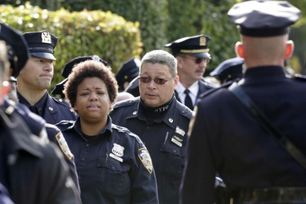 New York police officers arrive for the wake